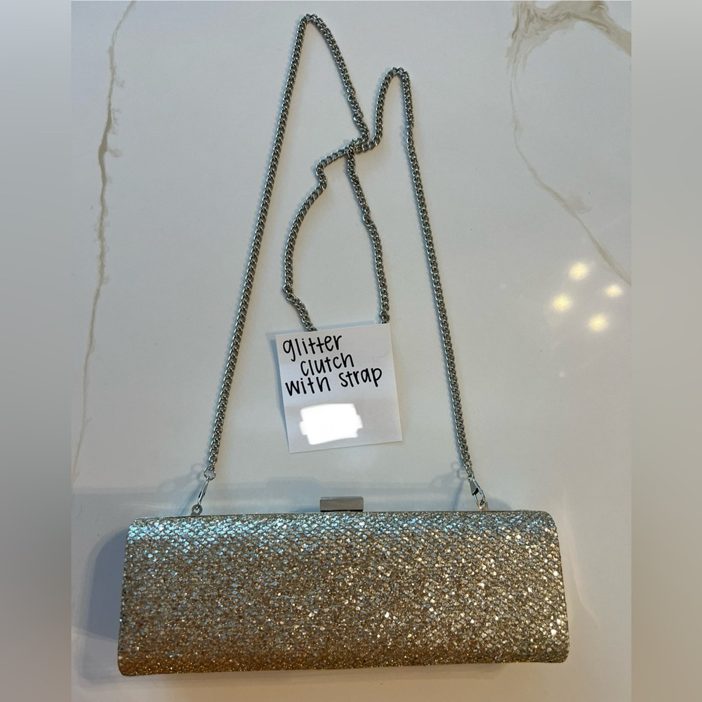 Gold glitter clutch with gold chain strap. Good condition.